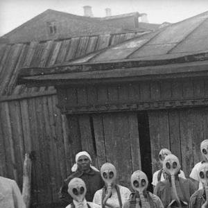 Absolutely terrifying: Group of girls wear their gas-masks during a gas drill. Moscow, 1930s